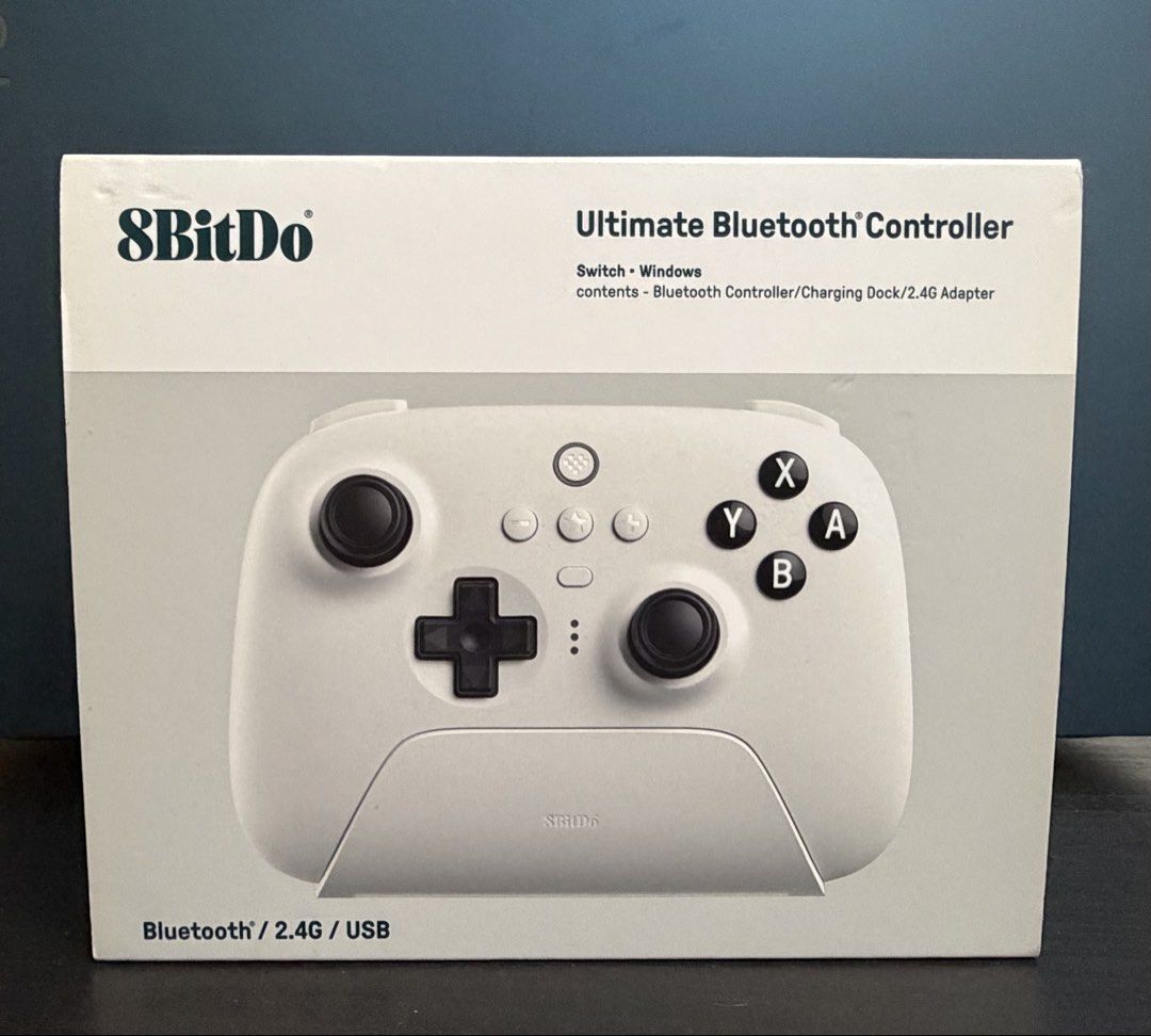 8bitdo Controller (Category: Controllers) located in Singapore. Submitted by jue23_k (Listing ID 1462986427, Image 2). Description: Price can be negotiable. Contents - Bluetooth Controller, Charging Dock, 2.4G Adapter .