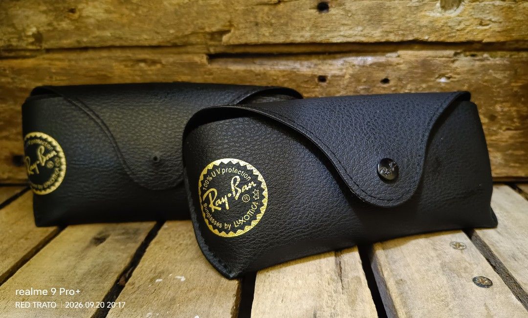 💯 Authentic Ray-Ban Sunglasses Cases Luxottica (Category: Sunglasses & Eyewear) located in General Mariano Alvarez. Submitted by randzwurkz85264 (Listing ID 1463054119, Image 1). Description: - 2 black Ray-Ban sunglasses cases. - 1pc all goods 800 - 1pc. has an issue of lost front snap on button 500 - Features the classic Ray-Ban logo - Ideal for storing and protecting your sunglasses - Keep your Ray-Ban shades safe and scratch-free.