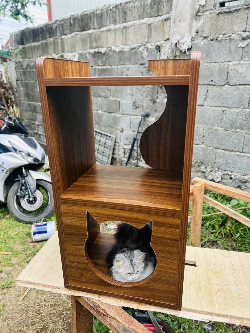 🐱 CAT BED + SIDE TABLE + COFFEE TABLE — ALL IN ONE! (Category: Homes & Other Pet Accessories) located in Davao. Submitted by casadekuting (Listing ID 1463012706, Image 1). Description: 🐱 CAT BED + SIDE TABLE + COFFEE TABLE — ALL IN ONE! A stylish piece of furniture for both you and your fur babies. 🐾 📐 Size: 81 × 44 × 35 cm 🪵 Material: 18mm Marine Laminated Plywood ✨ Durable laminated finish 🐱 Spacious cat hideaway ☕ Doubles as a bedside / 