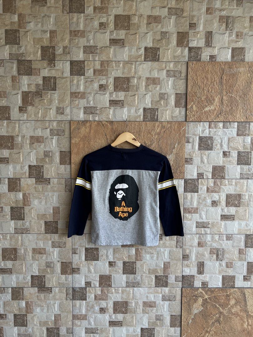 A BATHING APE - BAPE KIDS BIG HEAD BACK DESIGN LONGSLEEVES (Category: Babies & Kids Fashion) located in Bacolod City. Submitted by timelessbyjosh (Listing ID 1463035005, Image 3). Description: BEST FOR STREETWEAR OUTFITS SIZE : 140 ACTUAL COLOR : NAVY BLUE , WHITE , YELLOW & ORANGE COLOR RATE : 9. 5 OUT OF 10 CONDITION : EXCELLENT MATERIAL : 100 % COTTON ( BODY ) & 95 % COTTON & 5 % POLYURETHANE ( RIB PART ) MADE IN : FLAWS : NONE DIMENSIONS LENG