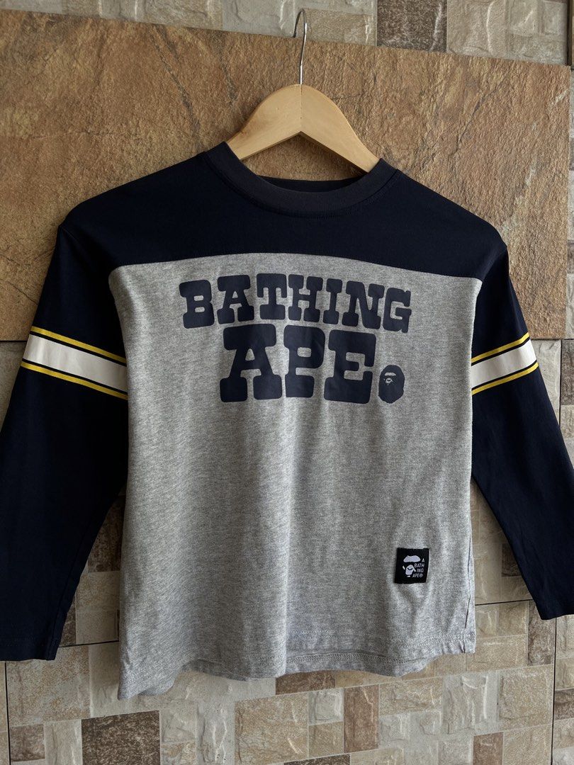 A BATHING APE - BAPE KIDS BIG HEAD BACK DESIGN LONGSLEEVES (Category: Babies & Kids Fashion) located in Bacolod City. Submitted by timelessbyjosh (Listing ID 1463035005, Image 2). Description: BEST FOR STREETWEAR OUTFITS SIZE : 140 ACTUAL COLOR : NAVY BLUE , WHITE , YELLOW & ORANGE COLOR RATE : 9. 5 OUT OF 10 CONDITION : EXCELLENT MATERIAL : 100 % COTTON ( BODY ) & 95 % COTTON & 5 % POLYURETHANE ( RIB PART ) MADE IN : FLAWS : NONE DIMENSIONS LENG