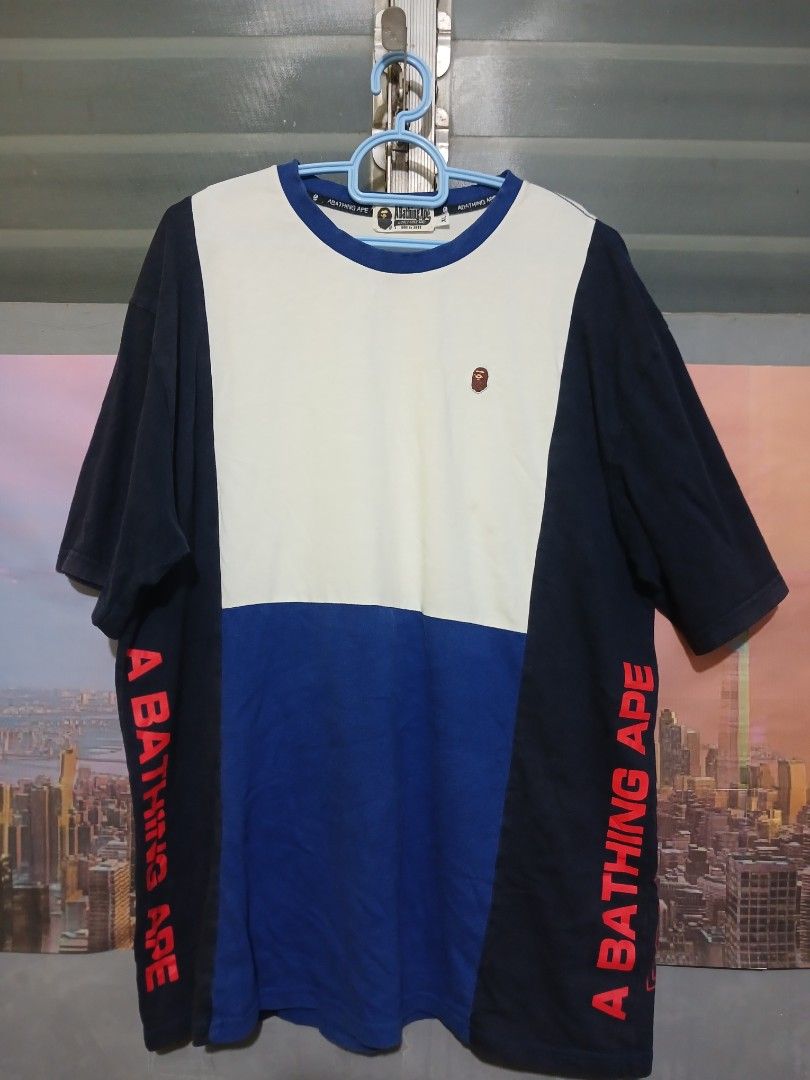 A Bathing Ape Colorblock Long Sleeve Tee (Category: Tshirts & Polo Shirts ) located in Valencia. Submitted by mahartinmo19925 (Listing ID 1463018290, Image 1). Description: - BAPE colorblock long sleeve t-shirt - Features white, blue, and navy color panels - "A BATHING APE" graphic printed on the sleeves - Small BAPE logo detail on the chest - Classic streetwear piece, perfect for layering or standalone wear.
