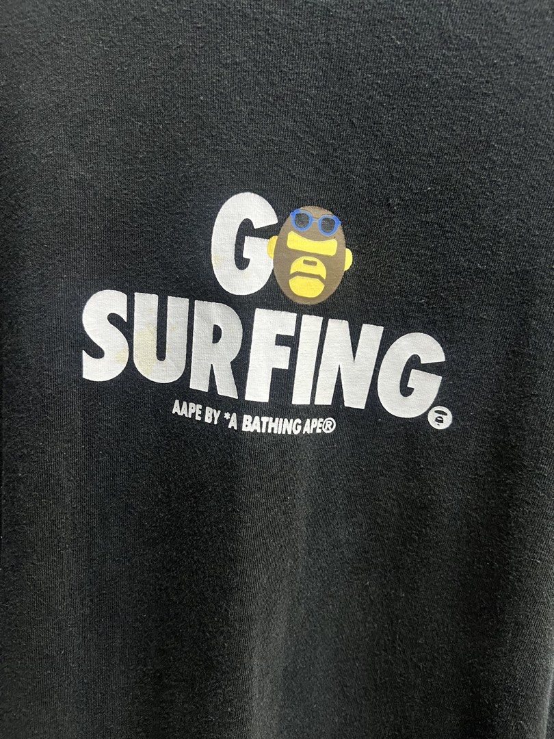 AAPE BY A BATHING APE "Go Surfing" Graphic Tee (Category: Tshirts & Polo Shirts ) located in Manila. Submitted by irenekaren57943 (Listing ID 1463011377, Image 2). Description: 𒊹︎𝐀𝐀𝐏𝐄 𝐒𝐡𝐢𝐫𝐭 ➤ 𝟐𝟎.𝟓 𝐖 | 𝟐𝟗 𝐋 ➤ 𝟗.𝟖 | 𝐋𝐢𝐤𝐞 𝐍𝐞𝐰 ➤ 𝐈𝐬𝐬𝐮𝐞: 𝐋𝐚𝐬𝐭 𝐏𝐢𝐜! .