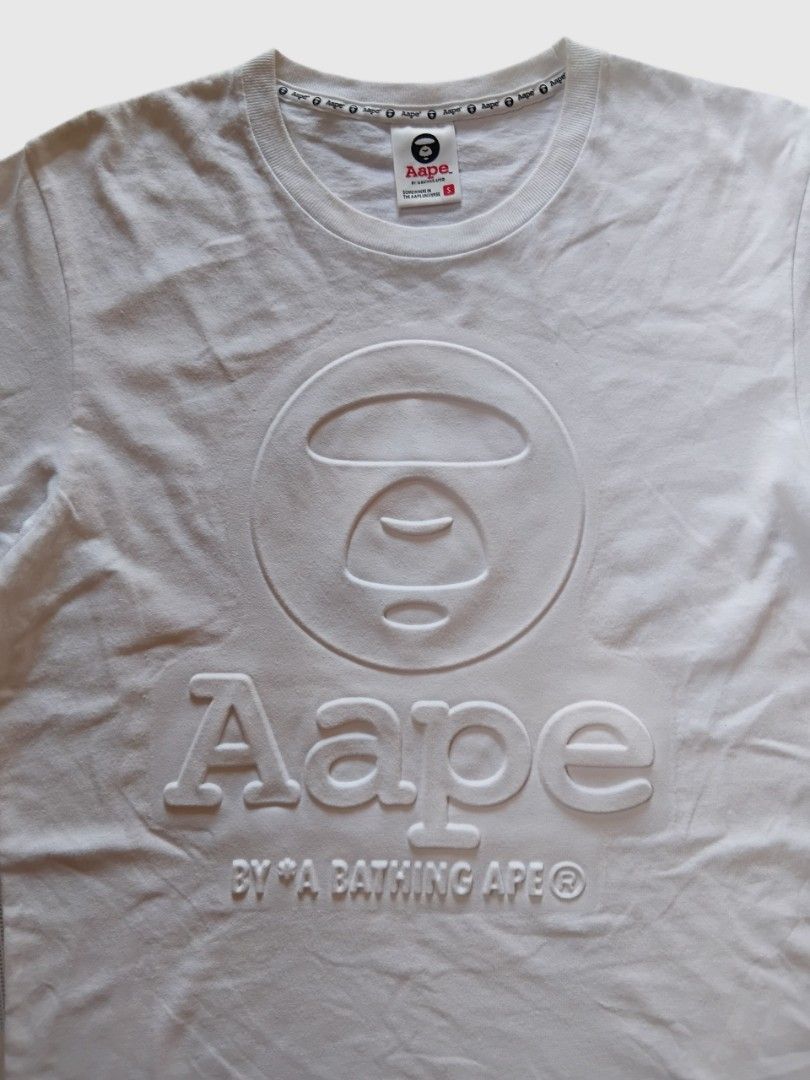 Aape by abathing ape embossed (Category: Tshirts & Polo Shirts ) located in Malasiqui. Submitted by v.hype (Listing ID 1463007392, Image 2). Description: Aape by abathing ape embossed size: small on tag fit to meduim dimension: 19w 26L excellent condition price : 1000 pesos + ship.