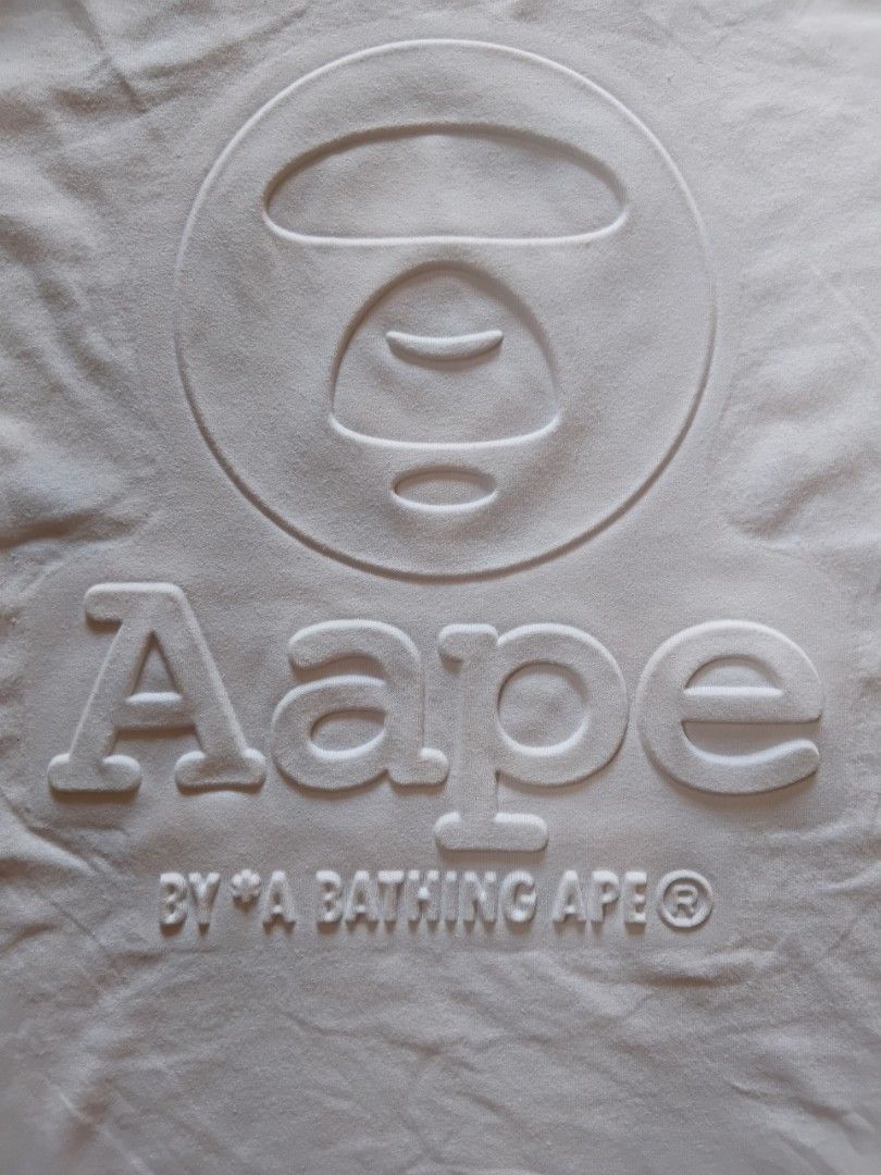 Aape by abathing ape embossed (Category: Tshirts & Polo Shirts ) located in Malasiqui. Submitted by v.hype (Listing ID 1463007392, Image 3). Description: Aape by abathing ape embossed size: small on tag fit to meduim dimension: 19w 26L excellent condition price : 1000 pesos + ship.