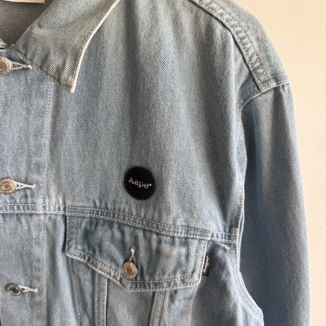 Aape Light-Wash Denim Jacket (Category: Coats, Jackets and Outerwear) located in San Fernando. Submitted by jorjorr (Listing ID 1463038532, Image 3). Description: Aape Light-Wash Denim Jacket Rainbow logo patch at the back Embroidered Logo Xs on tag 22 width 26 length Best fit small to medium Excellent condition No issue P1,899.