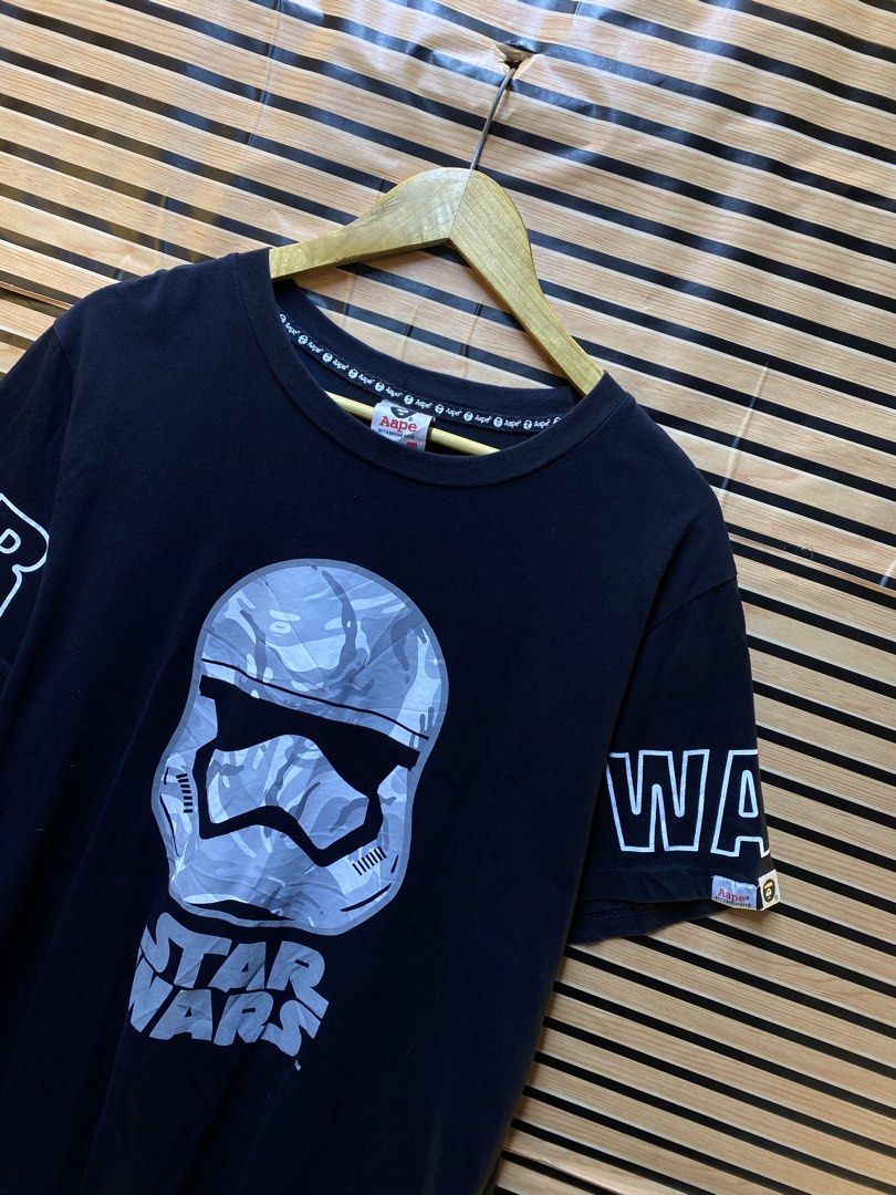 AAPE X STAR WARS TEE (Category: Tshirts & Polo Shirts ) located in Makati City. Submitted by drip.poww (Listing ID 1462944799, Image 2). Description: - Authentic Aape x Star wars - Color: Black - Size: XXL on tag - Dimes: 23x28 - Authentic - Excellent condition - Need wash, fresh from bale - Material: 100% Cotton Please don’t expect too much—these are thrifted (ukay) items. 😊 !!STILL NEGOTIABLE!!.