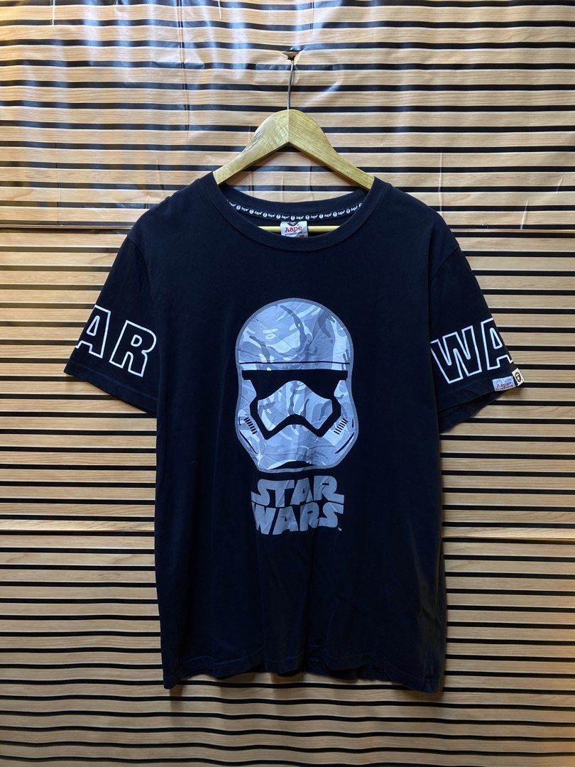 AAPE X STAR WARS TEE (Category: Tshirts & Polo Shirts ) located in Makati City. Submitted by drip.poww (Listing ID 1462944799, Image 1). Description: - Authentic Aape x Star wars - Color: Black - Size: XXL on tag - Dimes: 23x28 - Authentic - Excellent condition - Need wash, fresh from bale - Material: 100% Cotton Please don’t expect too much—these are thrifted (ukay) items. 😊 !!STILL NEGOTIABLE!!.
