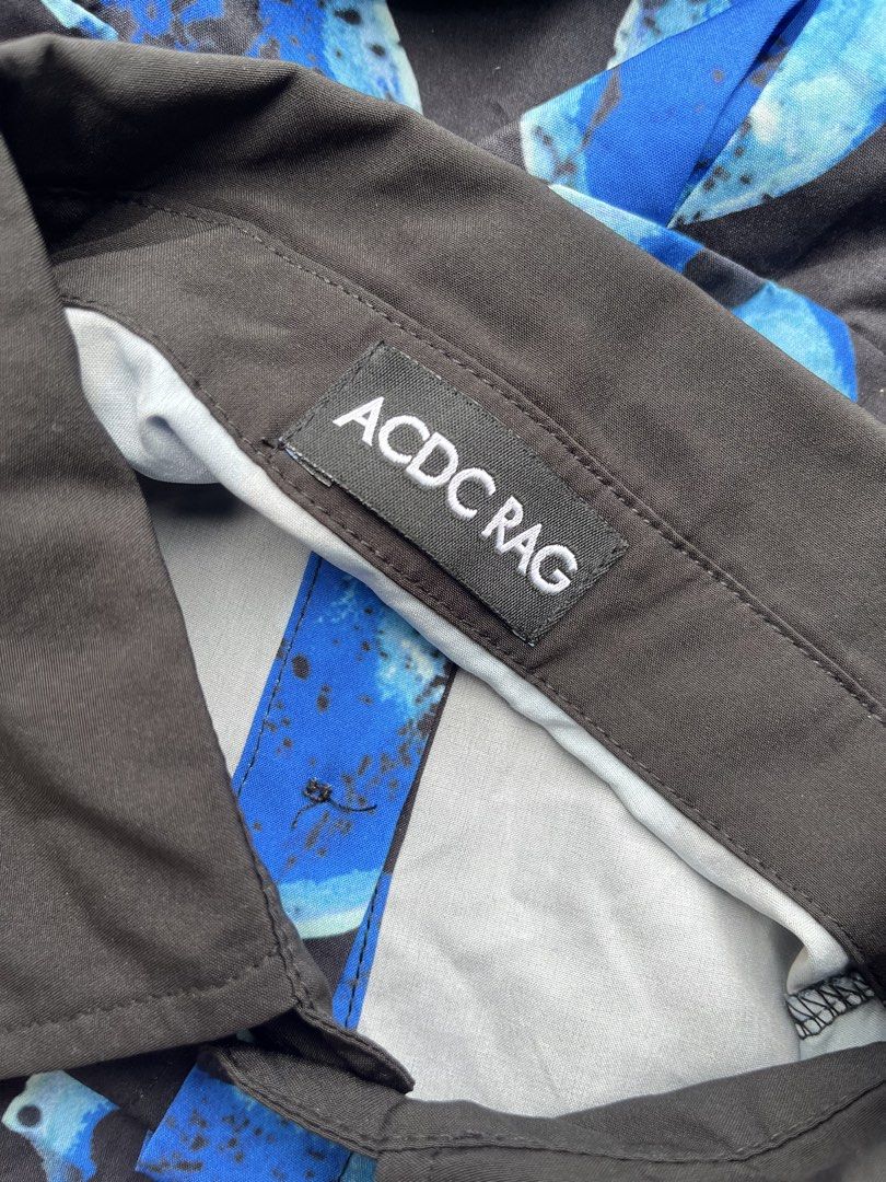 ACDC RAG Blue Abstract Print Long Sleeve Shirt (Category: Tshirts & Polo Shirts ) located in Bacoor. Submitted by 4103archivalgarmentph (Listing ID 1463036172, Image 3). Description: - Unique blue abstract print ACDC RAG shirt - Long sleeves with button cuffs - Contrasting black collar and cuffs - Made in PRC - Perfect for a statement outfit -23w -28L.