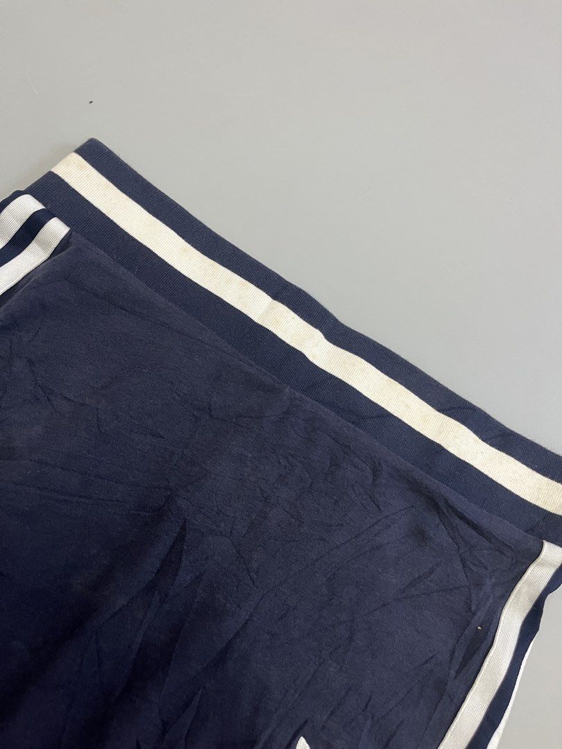 Adidas 3 Stripes Mini Skirt Navy Blue (Category: Skirts) located in Mabalacat. Submitted by aas_thriftfings (Listing ID 1462929256, Image 3). Description: - Navy blue Adidas mini skirt - Features classic three stripes on sides - Iconic trefoil logo - Comfortable elastic waistband - Ideal for casual or sporty looks - Pairs well with t-shirts and crop tops.