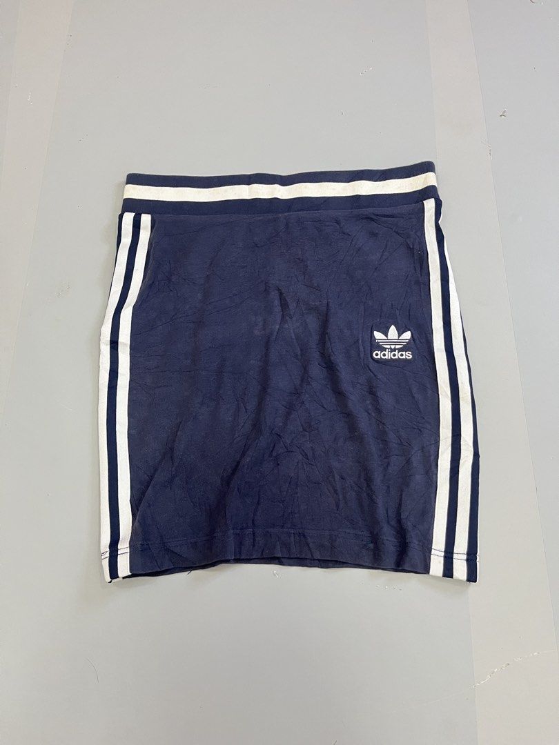Adidas 3 Stripes Mini Skirt Navy Blue (Category: Skirts) located in Mabalacat. Submitted by aas_thriftfings (Listing ID 1462929256, Image 1). Description: - Navy blue Adidas mini skirt - Features classic three stripes on sides - Iconic trefoil logo - Comfortable elastic waistband - Ideal for casual or sporty looks - Pairs well with t-shirts and crop tops.