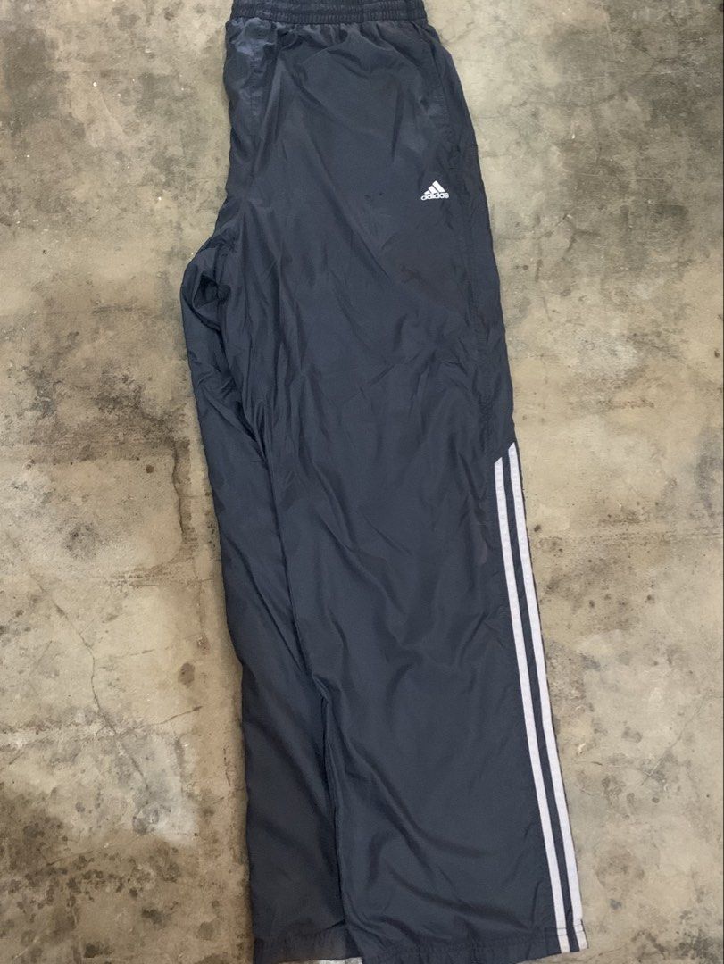Adidas 3 Stripes Track Pants Navy Blue (Category: Joggers) located in Manila. Submitted by thriftnivee (Listing ID 1463032972, Image 2). Description: - Classic navy blue Adidas track pants - White 3 stripes down the sides - Elastic waistband with drawstring - Made from 100% Nylon/Poliamide - Tag shows size L - Perfect for sports or casual wear.