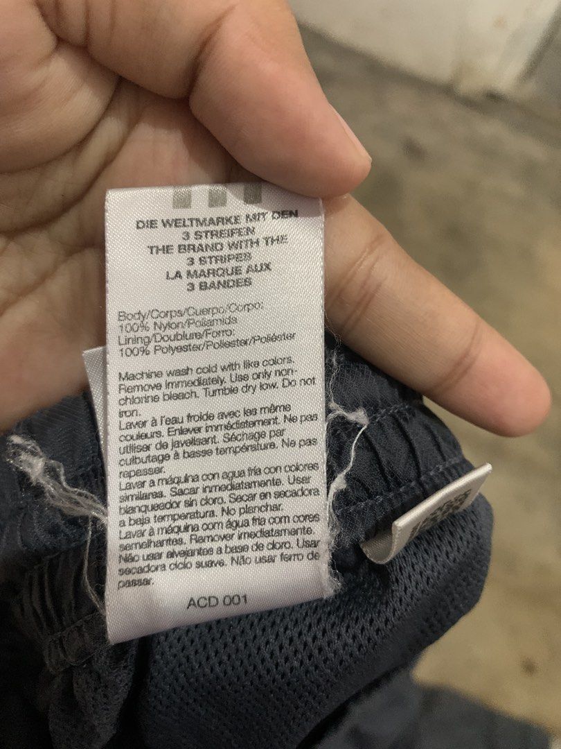 Adidas 3 Stripes Track Pants Navy Blue (Category: Joggers) located in Manila. Submitted by thriftnivee (Listing ID 1463032972, Image 3). Description: - Classic navy blue Adidas track pants - White 3 stripes down the sides - Elastic waistband with drawstring - Made from 100% Nylon/Poliamide - Tag shows size L - Perfect for sports or casual wear.