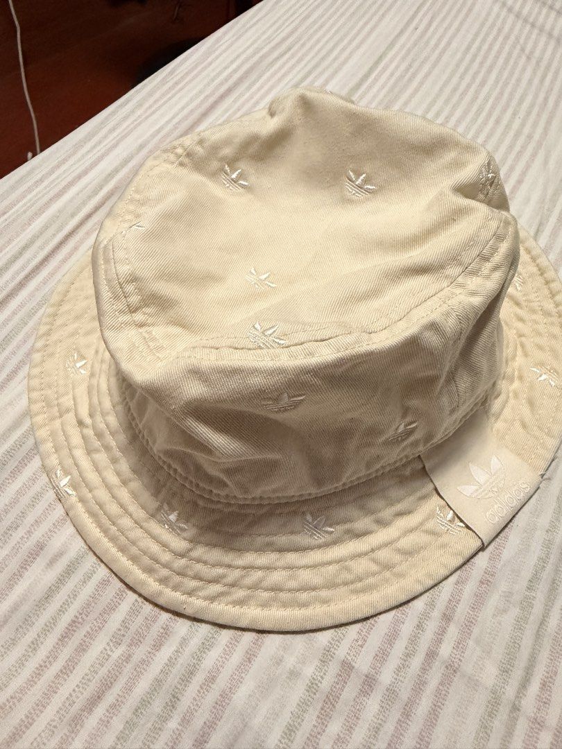 Adidas Bucket Hat Cream Monogram (Category: Caps & Hats) located in Manila. Submitted by spooder25 (Listing ID 1463114938, Image 1). Description: - Cream Adidas bucket hat - All-over monogram print - Classic bucket hat shape - Adidas tag attached - Ideal for sunny days - Clean and fresh look.