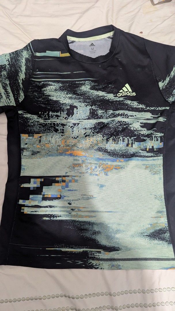 Adidas Climalite T-shirt Size M (Category: Tshirts & Polo Shirts ) located in Mati. Submitted by kepsky00 (Listing ID 1463024440, Image 2). Description: - Black Adidas T-shirt - Size Medium - Cool abstract graphic print - Short sleeves, crew neck - Climalite material for performance - Ideal for sports or casual wear.