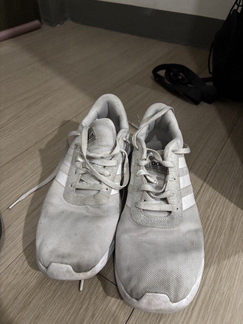 Adidas Lite Racer 2.0 White (Category: Sneakers) located in Manila. Submitted by emilener17 (Listing ID 1463016689, Image 2). Description: Adidas Lite Racer 2.0 White Size: US 8.5 / UK 8 / FR 42 / JP 265 - White Adidas running shoes - Lightweight and breathable mesh upper - Classic three-stripe design - Comfortable for everyday wear or light workouts - Note: Laces are a bit worn, soles show some dirt and scuffing..
