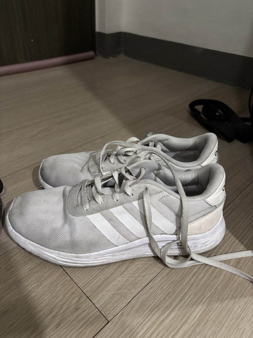 Adidas Lite Racer 2.0 White (Category: Sneakers) located in Manila. Submitted by emilener17 (Listing ID 1463016689, Image 1). Description: Adidas Lite Racer 2.0 White Size: US 8.5 / UK 8 / FR 42 / JP 265 - White Adidas running shoes - Lightweight and breathable mesh upper - Classic three-stripe design - Comfortable for everyday wear or light workouts - Note: Laces are a bit worn, soles show some dirt and scuffing..