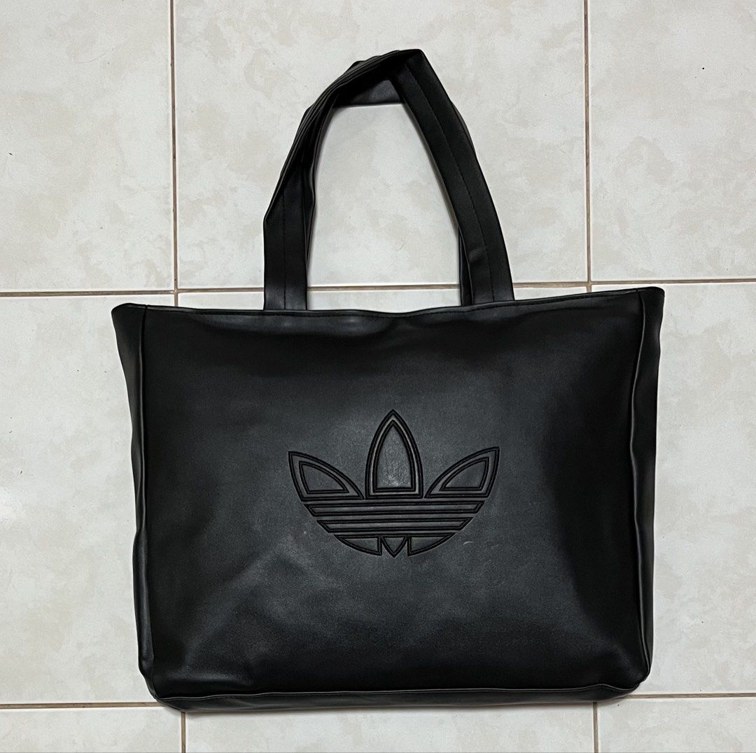 ADIDAS POLYURETHANE LEATHER TOTE BAG (Category: Tote Bags) located in Cavite. Submitted by drip_syndicate (Listing ID 1463102538, Image 1). Description: CONDITION: 9.5/10 COLOR RATE: 9.5/10 NO ISSUE .