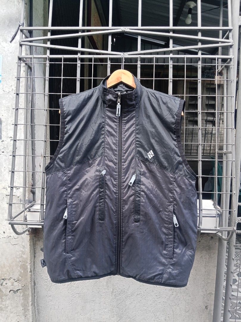 Adidas Reversible Vest Black (Category: Vests) located in Lingayen. Submitted by rahzzelula73279 (Listing ID 1463066130, Image 1). Description: - Black Adidas vest - Size M - Lightweight and sleeveless - Multiple zippered pockets on the front - Reversible zipper pull - Made in Vietnam - Ideal for layering or active wear.