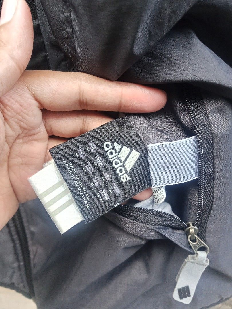 Adidas Reversible Vest Black (Category: Vests) located in Lingayen. Submitted by rahzzelula73279 (Listing ID 1463066130, Image 2). Description: - Black Adidas vest - Size M - Lightweight and sleeveless - Multiple zippered pockets on the front - Reversible zipper pull - Made in Vietnam - Ideal for layering or active wear.