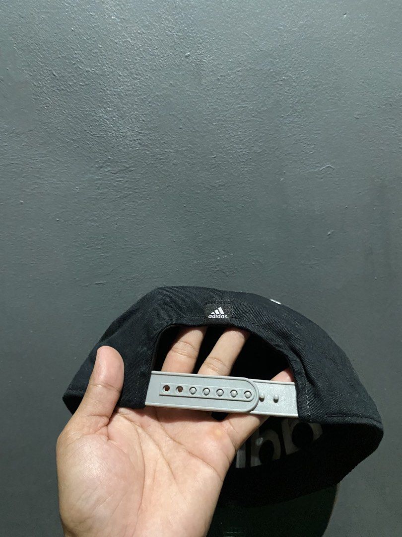 Adidas Snapback Cap Black White Grey (Category: Caps & Hats) located in Lucena. Submitted by handpickthrift (Listing ID 1462937142, Image 3). Description: - Classic black Adidas snapback - Bold white embroidered Adidas logo on the front - Light grey brim - Adjustable strap at the back for a comfortable fit - Perfect for everyday wear.