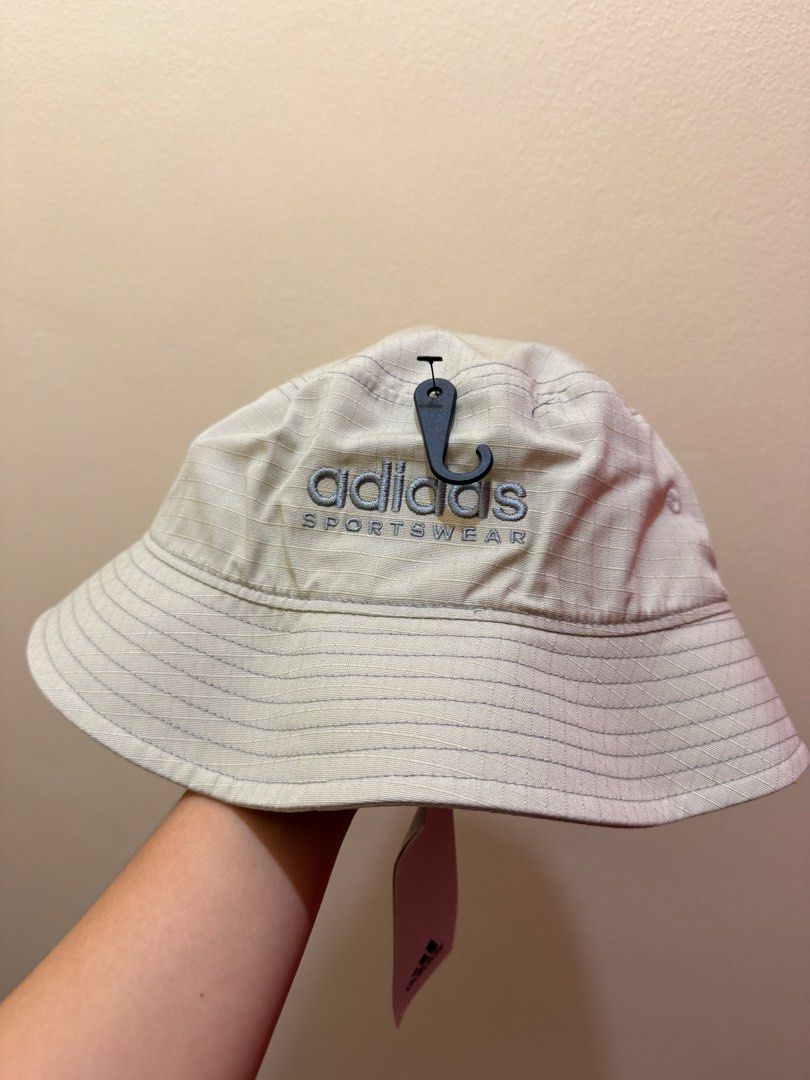 Adidas Sportswear Bucket Hat (Category: Other Sports Equipment and Supplies) located in Manila. Submitted by specter2026 (Listing ID 1462887299, Image 2). Description: - Adidas bucket hat - Color: Putty Grey / Grey Three - Brand new with tags attached - Comes in original recycled plastic bag - Size: One Size Fits Most (OSFM) - Ideal for sunny weather and completing a streetwear outfit - selling for the original price but negotiable RFS: won’t be 
