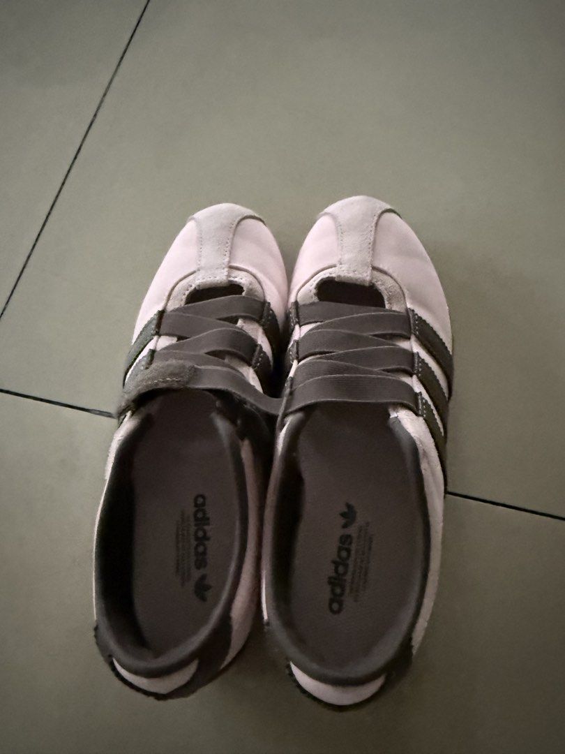 Adidas Tokyo Pink & Grey Sneakers (Category: Sneakers) located in Subic. Submitted by pampelonne (Listing ID 1462924316, Image 1). Description: - Adidas Tokyo sneakers in light pink and grey. - Classic three-stripe design. - Easy slip-on style with adjustable straps. - Light brown gum soles. - Ideal for casual outings or light training..