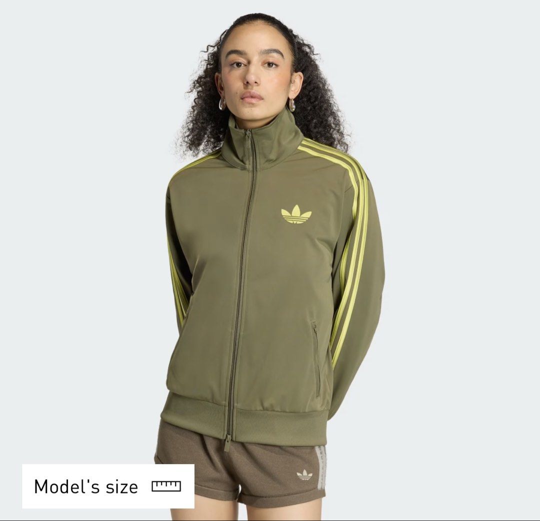 Adidas Track Jacket (Category: Coats, Jackets and Outerwear) located in Pasay City. Submitted by trash_or_treasure.543 (Listing ID 1462939470, Image 2). Description: This is Adidas Track Jacket accented with yellow three stripes details and the classic trefoil logo Authentic Size: medium Dimensions: Width: 19 Length: 24 Sleeve Length: 21 Price negotiable .