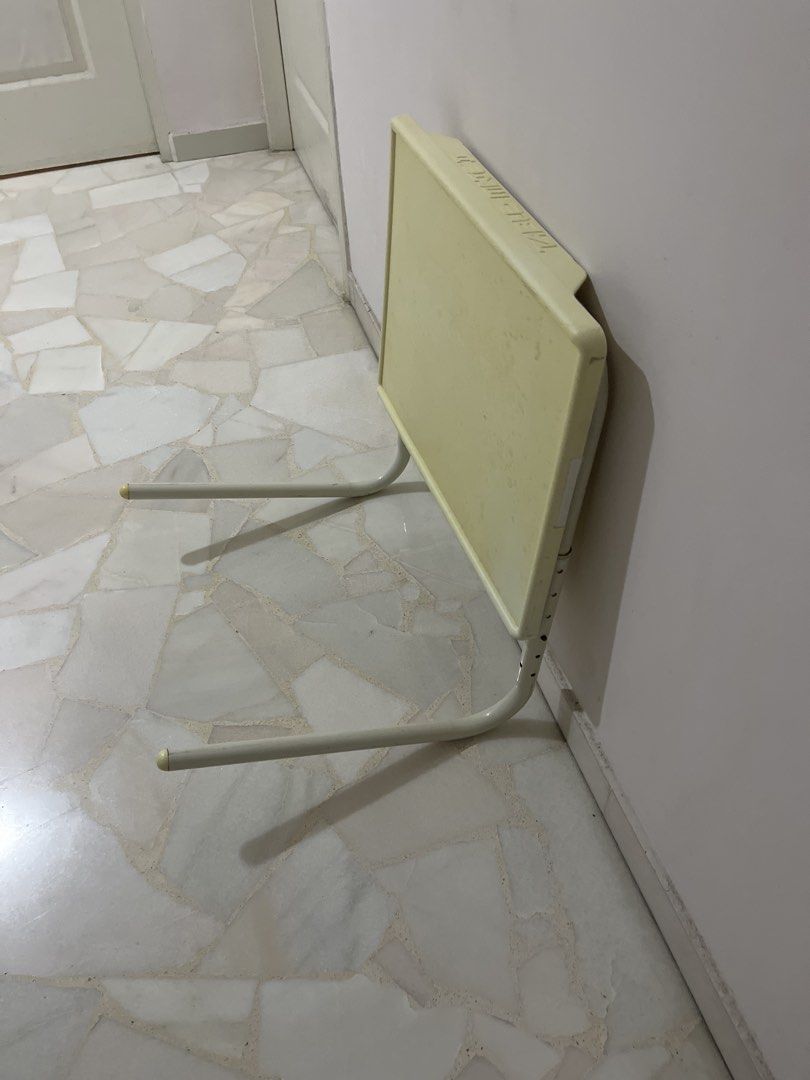 Adjustable Height Foldable Side Table (Category: Tables & Sets) located in Singapore. Submitted by hellofh (Listing ID 1463030282, Image 3). Description: Self collection at Bishan 50*40cm - Lightweight and portable - Adjustable height for versatile use - Folds flat for easy storage - Top surface has some marks from use - Ideal for snacks, drinks, or a small workspace.