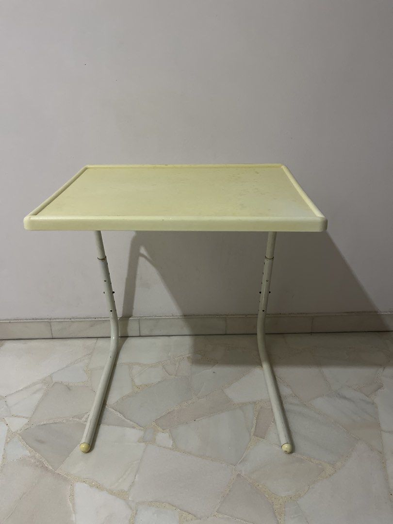 Adjustable Height Foldable Side Table (Category: Tables & Sets) located in Singapore. Submitted by hellofh (Listing ID 1463030282, Image 1). Description: Self collection at Bishan 50*40cm - Lightweight and portable - Adjustable height for versatile use - Folds flat for easy storage - Top surface has some marks from use - Ideal for snacks, drinks, or a small workspace.