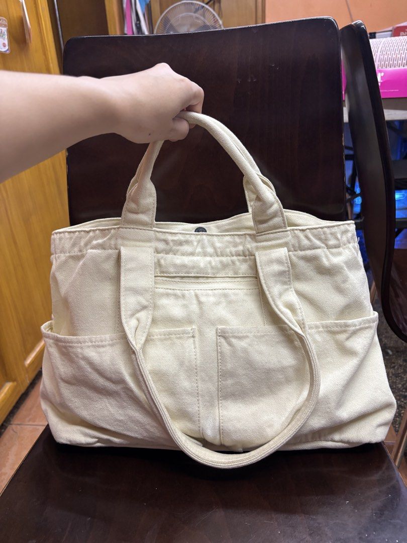 Aeropostale Canvas Tote Bag (Category: Tote Bags) located in Manila. Submitted by robbyrabbit (Listing ID 1462916615, Image 2). Description: - Cream colored canvas tote bag from Aeropostale - Snap closure for secure access - Multiple exterior pockets for quick storage - Interior zippered pocket and slip pocket for organization - Spacious and ideal for everyday use.