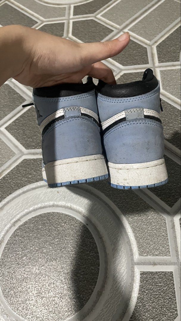 Air Jordan 1 High University Blue (Category: Sneakers) located in Iloilo. Submitted by puzzles_xxx (Listing ID 1462900547, Image 2). Description: - Air Jordan 1 High 'University Blue' - Classic high-top silhouette - Colorway: White, light blue, and black laces - Condition: Shows some signs of wear on soles and uppers (please check photos for details) - Made in China.