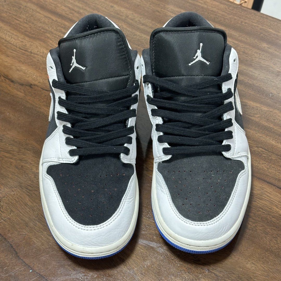 Air Jordan 1 Low OG "Black White" (Category: Sneakers) located in Cebu City. Submitted by jennierubyjane01 (Listing ID 1463027994, Image 3). Description: - Air Jordan 1 Low OG - Classic Black and White colorway - Low-top silhouette - Features Jumpman logo on tongue and heel - Blue accent on the outsole - Ideal for casual wear.