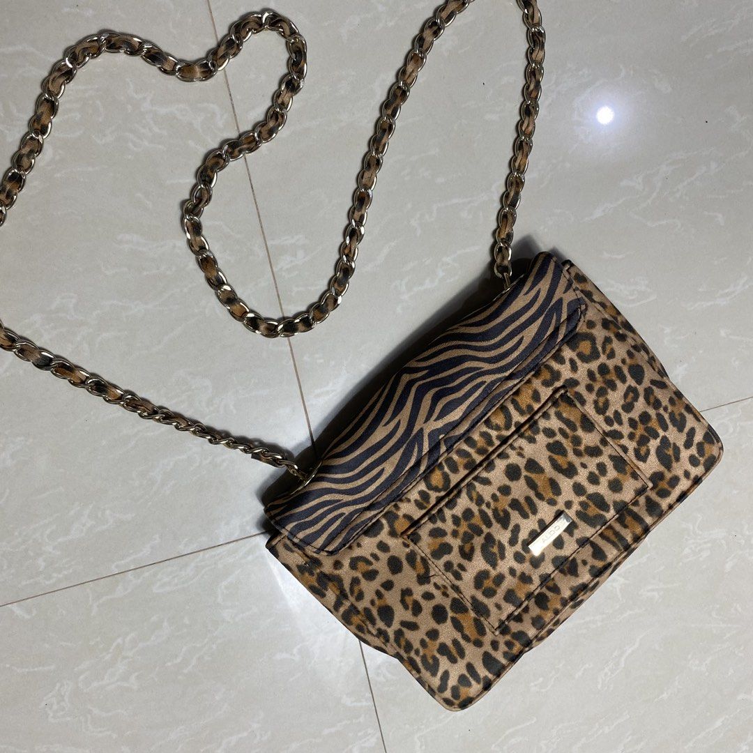 ALDO Zebra & Leopard Print Chain Crossbody Bag (Category: Cross-body Bags) located in Muntinlupa City. Submitted by ajdomingo504210 (Listing ID 1462886343, Image 3). Description: - Cute ALDO crossbody bag - Features a mix of zebra and leopard prints - Silver chain strap - Front pocket with ALDO logo - Secure clasp closure - Ideal for nights out or adding flair to your look -No issue .