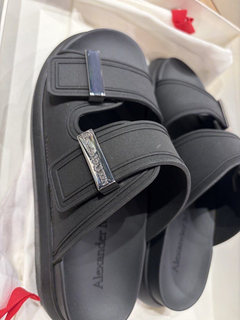 Alexander McQueen Black and White Rubber Slides Sandals (Category: Flats & Sandals) located in Cavite. Submitted by tripleKgels (Listing ID 1463046549, Image 1). Description: - Authentic Alexander McQueen slides in sleek black. - Durable and easy-to-clean rubber material. - Stylish double strap design with elegant silver buckle detail. - Comes complete with original dust bag and box. - Ideal for effortless casual styling. Black: 36/36.5/37/40 Whi