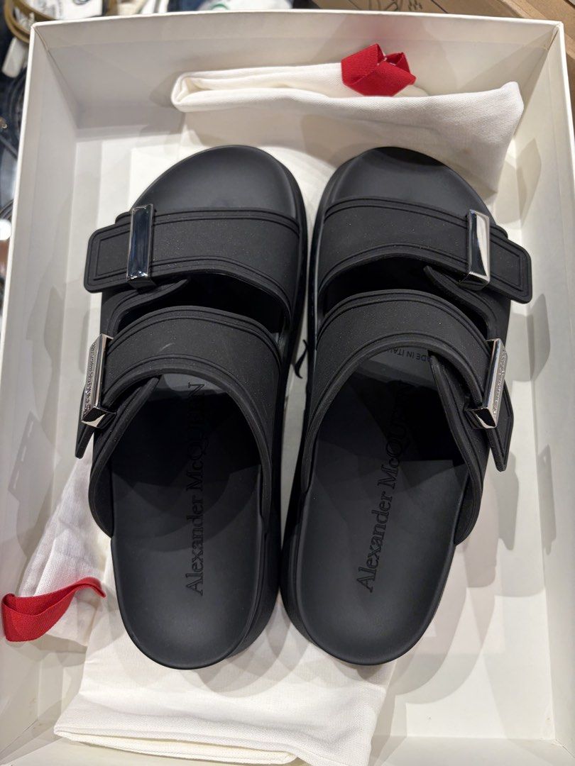 Alexander McQueen Black and White Rubber Slides Sandals (Category: Flats & Sandals) located in Cavite. Submitted by tripleKgels (Listing ID 1463046549, Image 2). Description: - Authentic Alexander McQueen slides in sleek black. - Durable and easy-to-clean rubber material. - Stylish double strap design with elegant silver buckle detail. - Comes complete with original dust bag and box. - Ideal for effortless casual styling. Black: 36/36.5/37/40 Whi