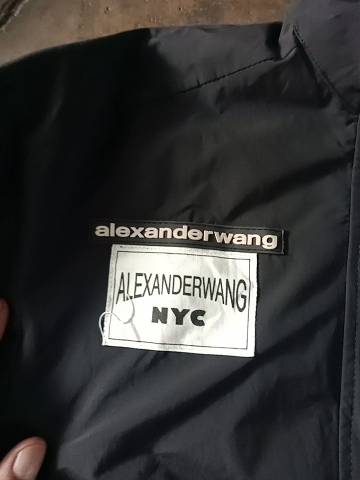 Alexander Wang Colorblock Track Jacket (Category: Coats, Jackets and Outerwear) located in Cabuyao City. Submitted by blake657 (Listing ID 1462910904, Image 2). Description: - Alexander Wang colorblock jacket - Classic black and white design with three stripes - Snap button closure - Material: 100% Polyester - Size: 2 - Ideal for casual wear or layering.