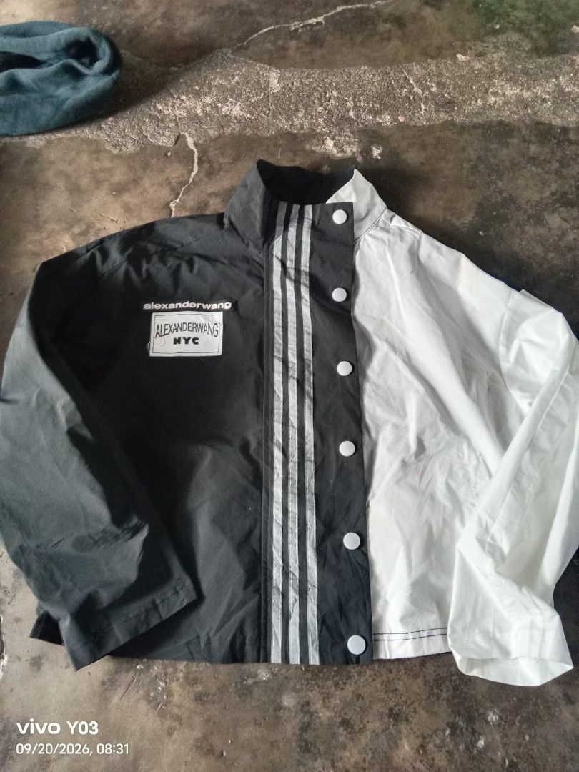 Alexander Wang Colorblock Track Jacket (Category: Coats, Jackets and Outerwear) located in Cabuyao City. Submitted by blake657 (Listing ID 1462910904, Image 1). Description: - Alexander Wang colorblock jacket - Classic black and white design with three stripes - Snap button closure - Material: 100% Polyester - Size: 2 - Ideal for casual wear or layering.