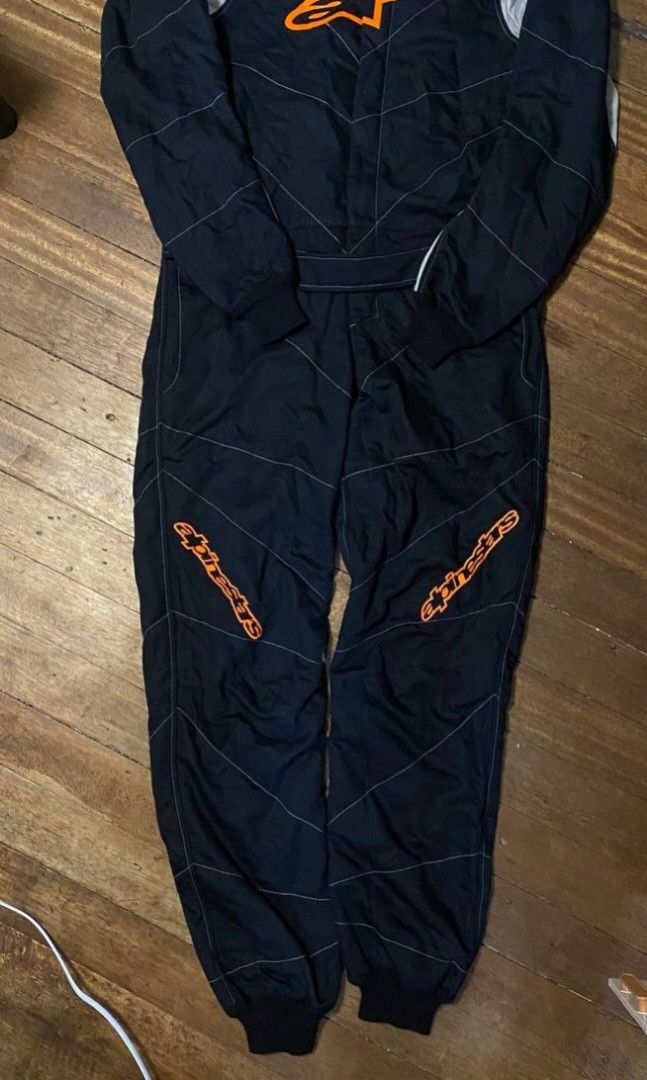 ALPINESTARS GP RACE SUIT (Category: Activewear) located in Cavite. Submitted by safehawk-c9a684 (Listing ID 1463055639, Image 2). Description: ALPINESTARS GP RACE SUIT 🏁🔥 Rare motorsport / racing suit from Alpinestars Black with orange detailing Size: US 36 / EU 46 thrifted Good overall condition Authentic Alpinestars labels & ID details Made in Romania / Designed & Developed in Italy Perfect for racing, motorsport collection, display, or enthu