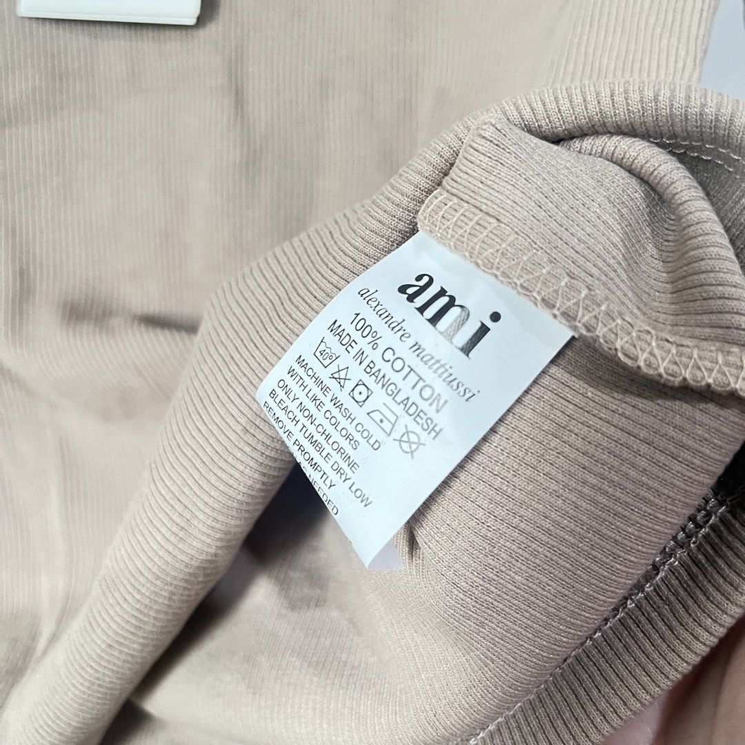 AMI Paris Ribbed T-Shirt (Category: Shirts) located in Quezon City. Submitted by shopnina (Listing ID 1462983405, Image 3). Description: - Brand: AMI Paris - Color: Beige - Style: Ribbed T-shirt - Logo: Signature Ami de Coeur patch on chest - Material: 100% Organic Cotton - Size: Medium (M) - Condition: Brand new with original tags - Perfect for: Casual wear, everyday styling -bought online over…ns RFS: decluttering.