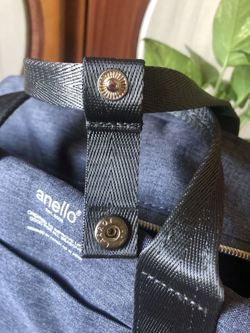 Anello Denim-like Duffle Bag (Category: Cross-body Bags) located in Makati City. Submitted by mitchi_koy28 (Listing ID 1462929443, Image 2). Description: - Anello duffle bag - Dark blue/grey denim-like material - Main zippered compartment - Front zippered pocket - Interior zippered pocket and slip pockets - Top handles with snap closure - Ideal for travel or everyday use.