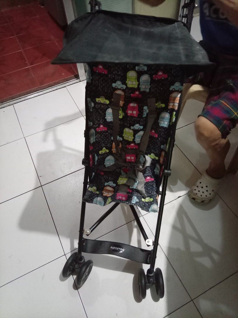 Apruva Lightweight Stroller with Car Print (Category: Strollers) located in Caloocan City. Submitted by maynaito (Listing ID 1463016846, Image 2). Description: - Apruva stroller with a fun car print fabric - Includes a canopy for sun protection - Equipped with a safety harness - Lightweight and easy to fold for convenience - Ideal for parents on the go Used only twice.