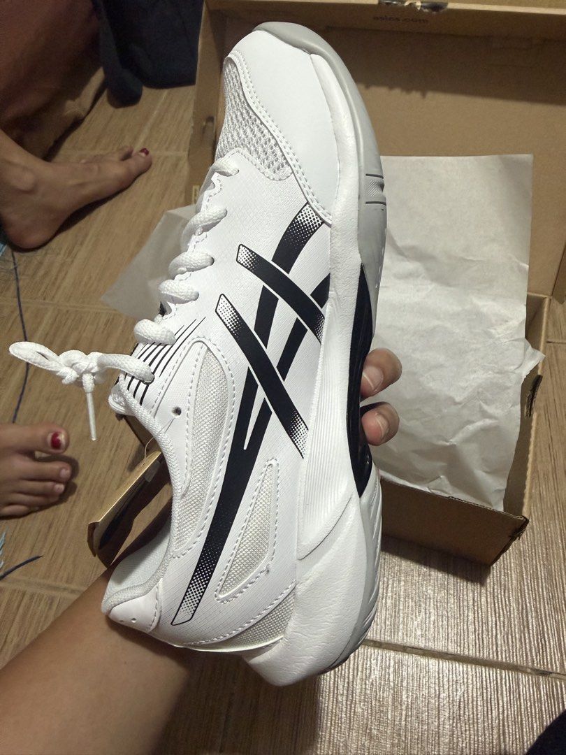 ASICS GEL-ROCKET 12 (Category: Sneakers) located in Taguig. Submitted by zelpremo (Listing ID 1462995414, Image 3). Description: - ASICS GEL-ROCKET 12 shoes - Color: White and Black - Ideal for volleyball/badminton and indoor court sports - Features a breathable mesh upper - Equipped with a durable rubber sole - Comes with original box and tags - Ready for your next game.