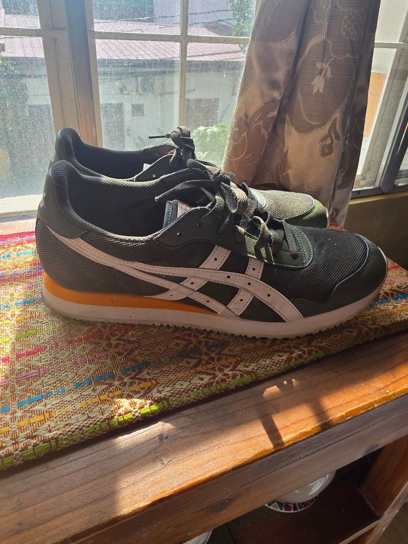 Asics Sneakers Green White (Category: Sneakers) located in Pasig City. Submitted by martymarcelo26 (Listing ID 1462946516, Image 2). Description: - Green Asics sneakers - Classic white stripes - Lace-up closure - Suitable for casual wear or light exercise - Minor scuffs on soles.