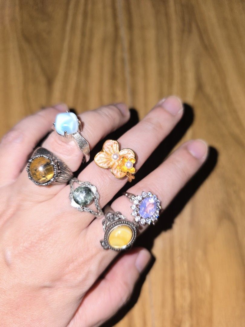 Assorted Gemstone & Enamel Rings Set (Category: Rings) located in Santa Rosa. Submitted by crystal1.0 (Listing ID 1462416157, Image 2). Description: 1. Larimar 2. Tiger's eye 3. lacquer Pearl 4. Seraphinite (Dark Green) 5. Moon Lavender 6. Amber Locket.