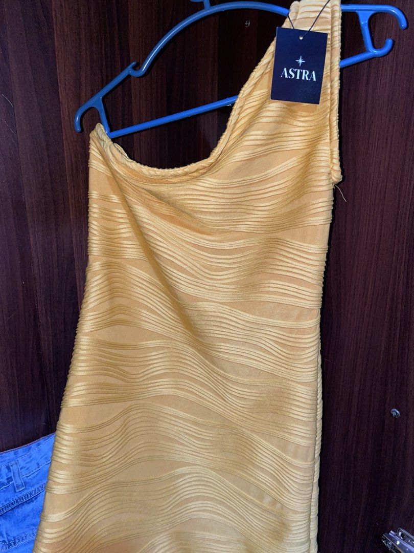 One-Shoulder Asymmetrical Mini Dress (Category: Dresses) located in Dagupan City. Submitted by wildbear-8415e8 (Listing ID 1463030058, Image 1). Description: - Brand: ASTRA - Color: Yellow - Style: One-shoulder mini dress - Features: Textured wavy pattern all over - Condition: Brand new with tag, never worn - Occasion: Ideal for night outs or parties.