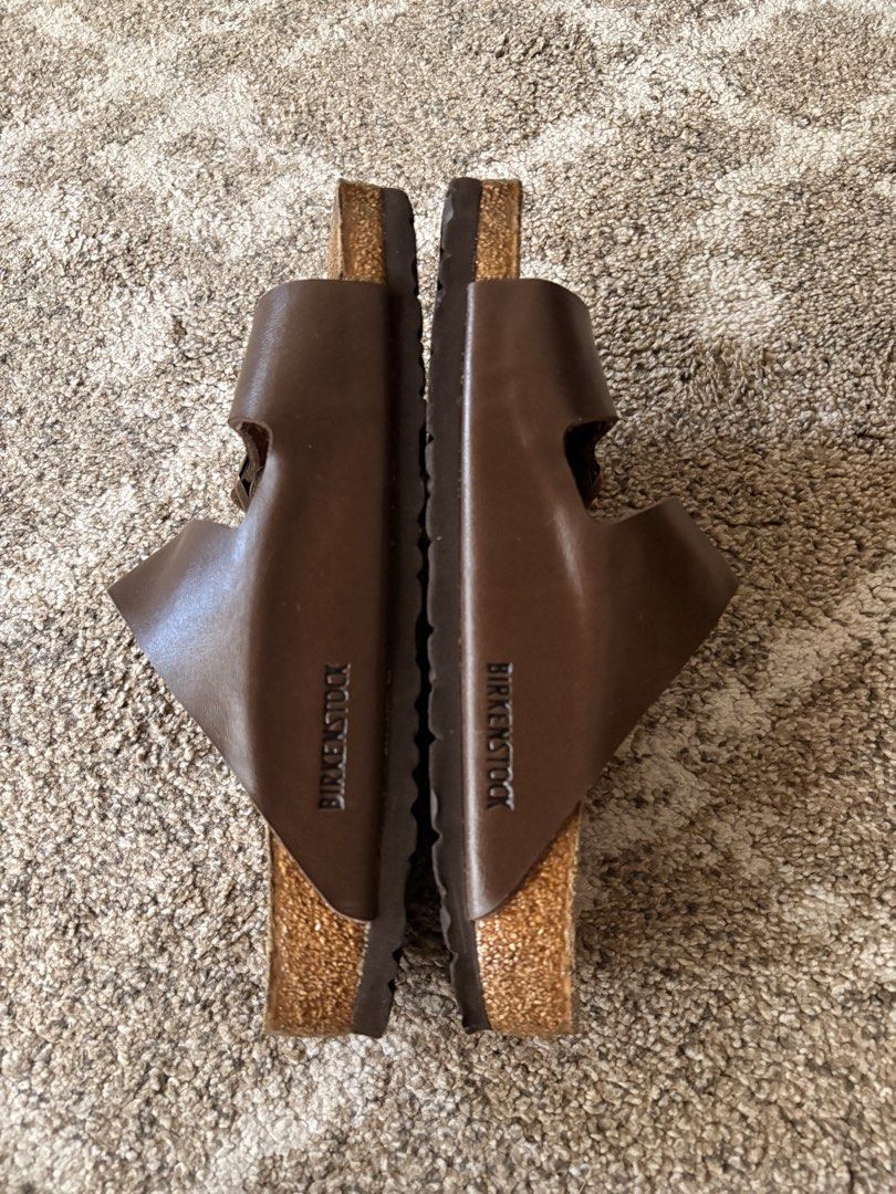 Auth Preloved Birkenstock Arizona (Category: Slippers & Slides) located in Paranaque City. Submitted by silentstone.dolphin (Listing ID 1463067482, Image 3). Description: Brown Strap.. Brass Buckle.. Visible Print.. Size 39R.. Clean&Ready to wear👌 Super nice in actual😍.
