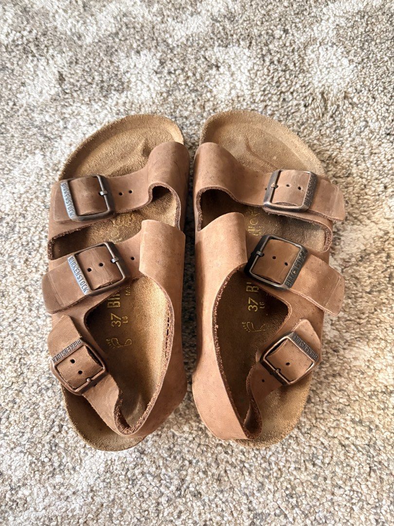 Auth Preloved Birkenstock Milano (Category: Slippers and slides) located in Paranaque City. Submitted by silentstone.dolphin (Listing ID 1463066284, Image 2). Description: Oiled Leather.. Brass Buckle.. Visible Print.. Size 37R.. Unisex.. Super Nice in Actual😍.