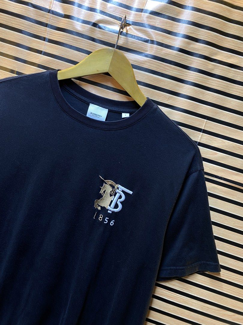 AUTHENTIC BURBERRY LONDON TEE (Category: Tshirts & Polo Shirts ) located in Makati City. Submitted by drip.poww (Listing ID 1462950925, Image 2). Description: - Authentic Burberry - Color: Black - Size: Large - Dimes: 23x27 - Authentic - Excellent condition - Need wash, fresh from bale - Material: 100% Cotton Please don’t expect too much—these are thrifted (ukay) items. 😊 !!STILL NEGOTIABLE!!.