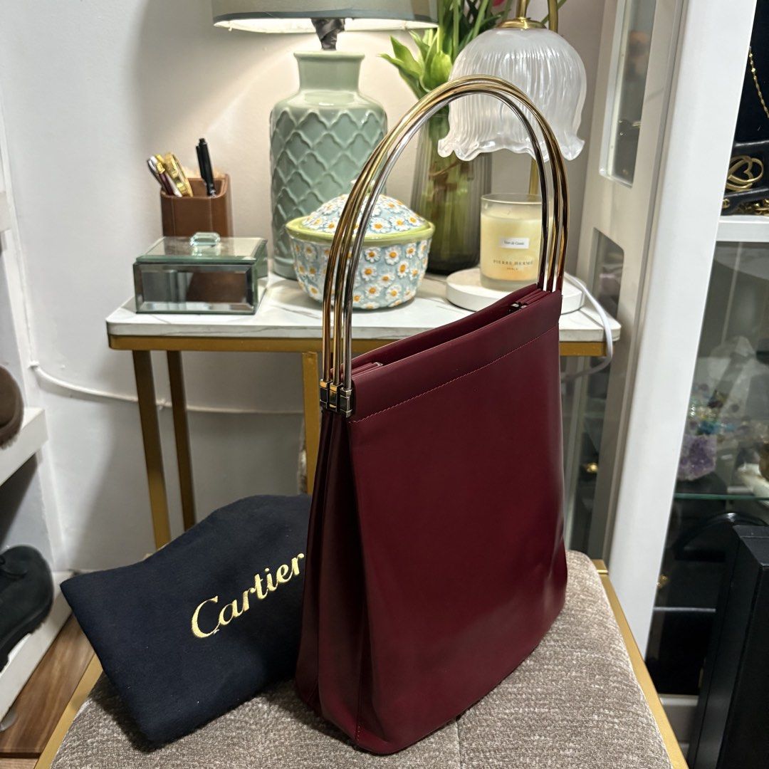 Authentic Cartier Trinity Burgundy Red Hand Bag (Category: Tote Bags) located in Binangonan. Submitted by makoleksyon (Listing ID 1462924319, Image 1). Description: Excellent condition Like new No flaws Crafted in High Quality Cartier Leather with Trinity Handles - given the meaning of Love, Fidelity and Friendship. Size: H-9.5 x W-8 x D-3.5 inches Bought in Japan 💯% Authentic Money back guarantee .